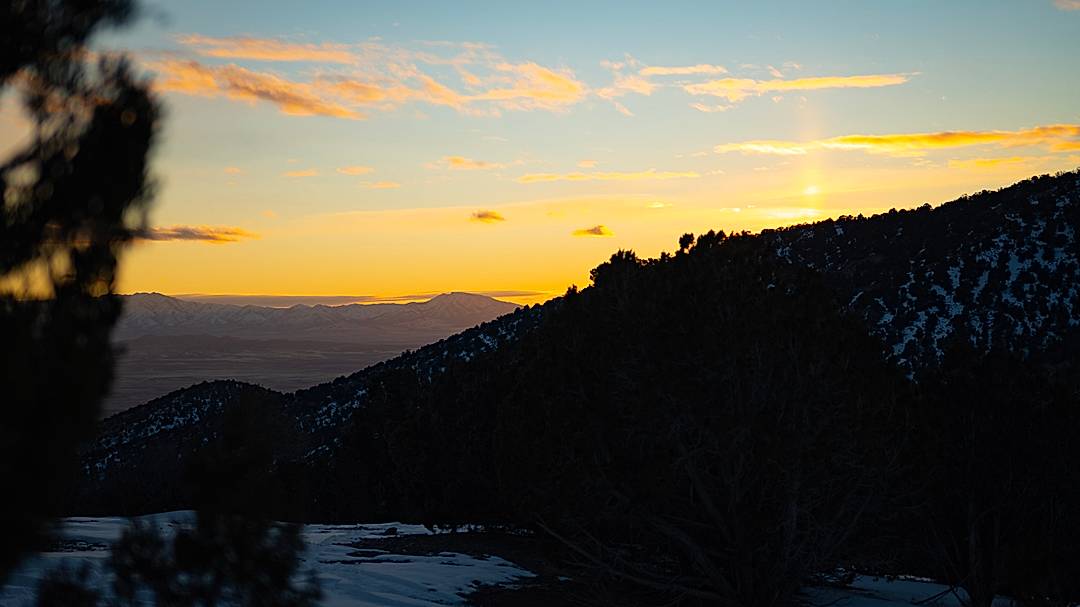 A cold January day sunset with ice crystal pillar reflection from the sun