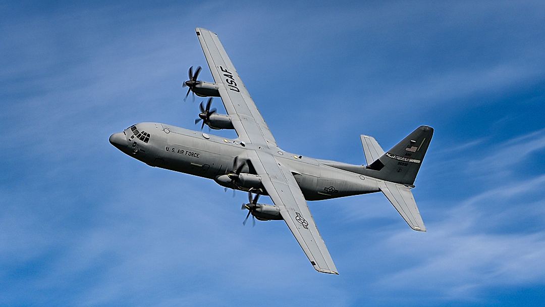 USAF C-130J-30 Hercules banking left to line up with the runway.