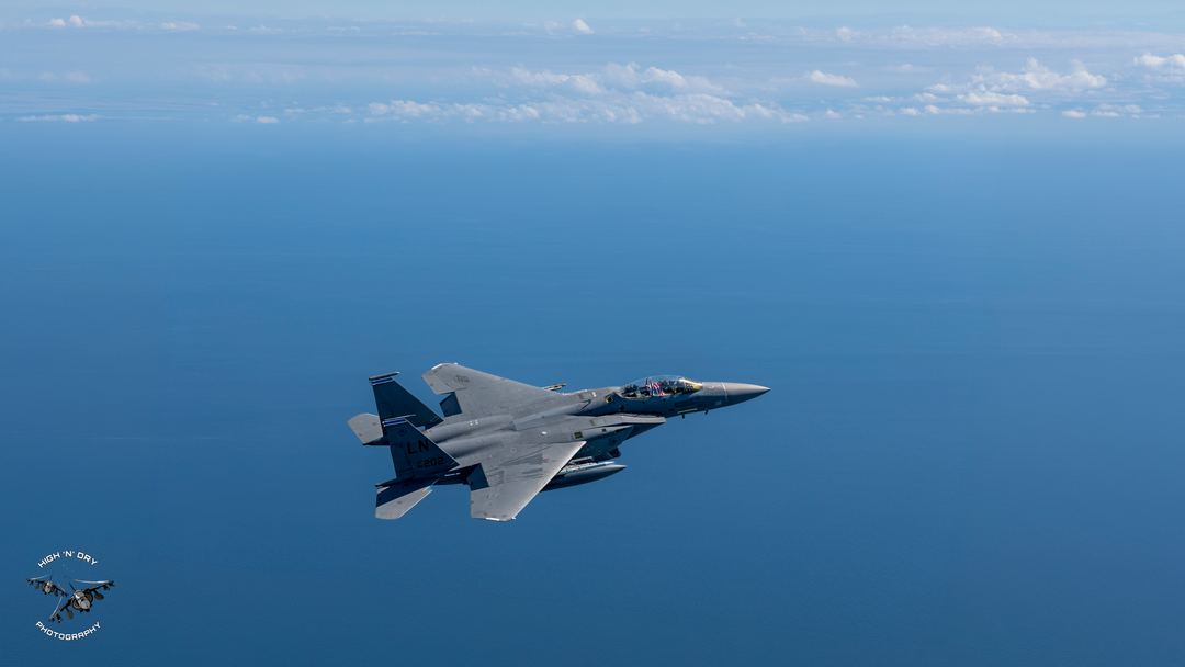 McDonnell Douglas F-15E Strike Eagle of the 48th Fighter Wing, call sign MUGGA11 over the Llyn peninsula, North Wales. With loads of negative space. 