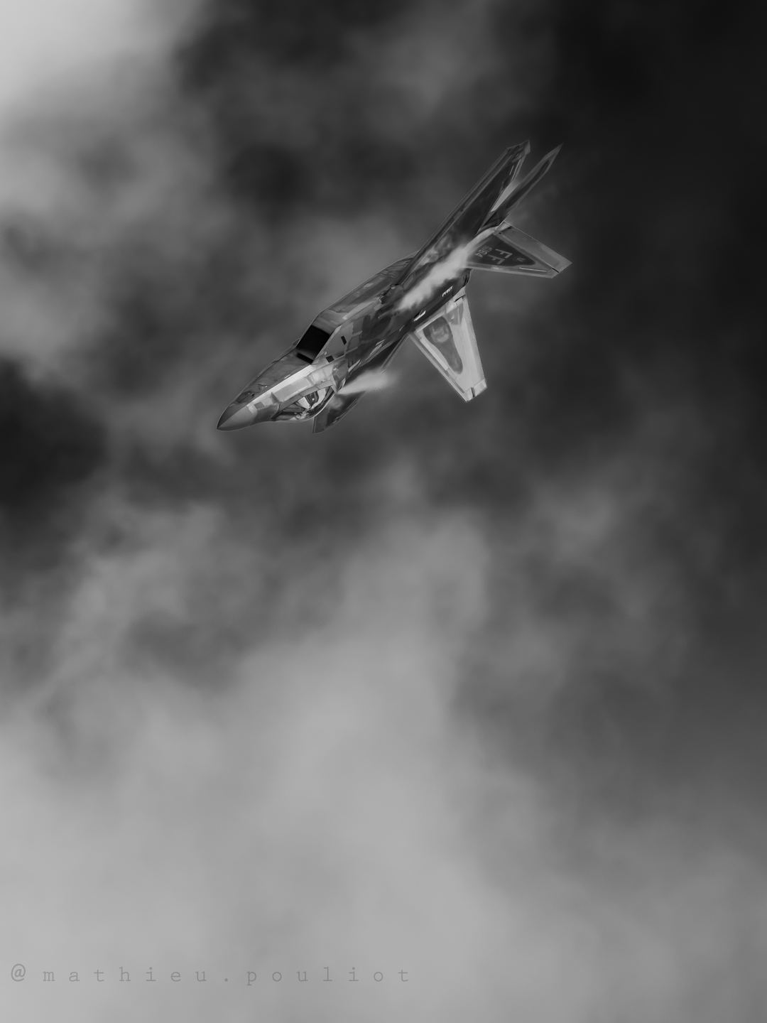 Demo Team F-22 upside down as it flies towards the ground.