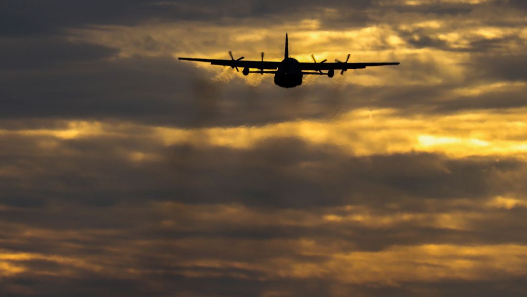 RNZAF C130H departing Perth into the sunrise skies 

