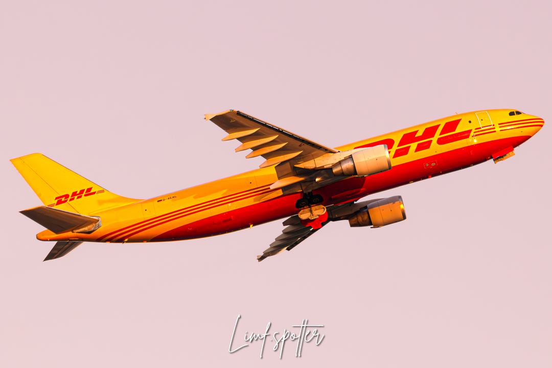 Dhl airbus a300 departing naples during golden/Pink hour
