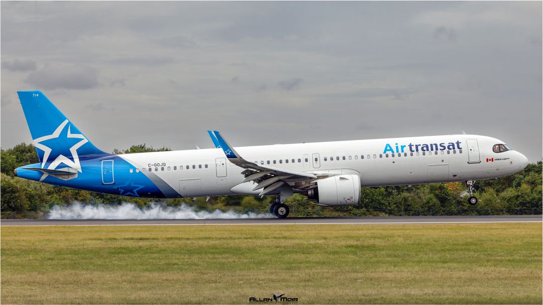 Air Transat A321-271NX touches down on runway 05R at EGCC arriving from Toronto. Shame about the grey sky!
