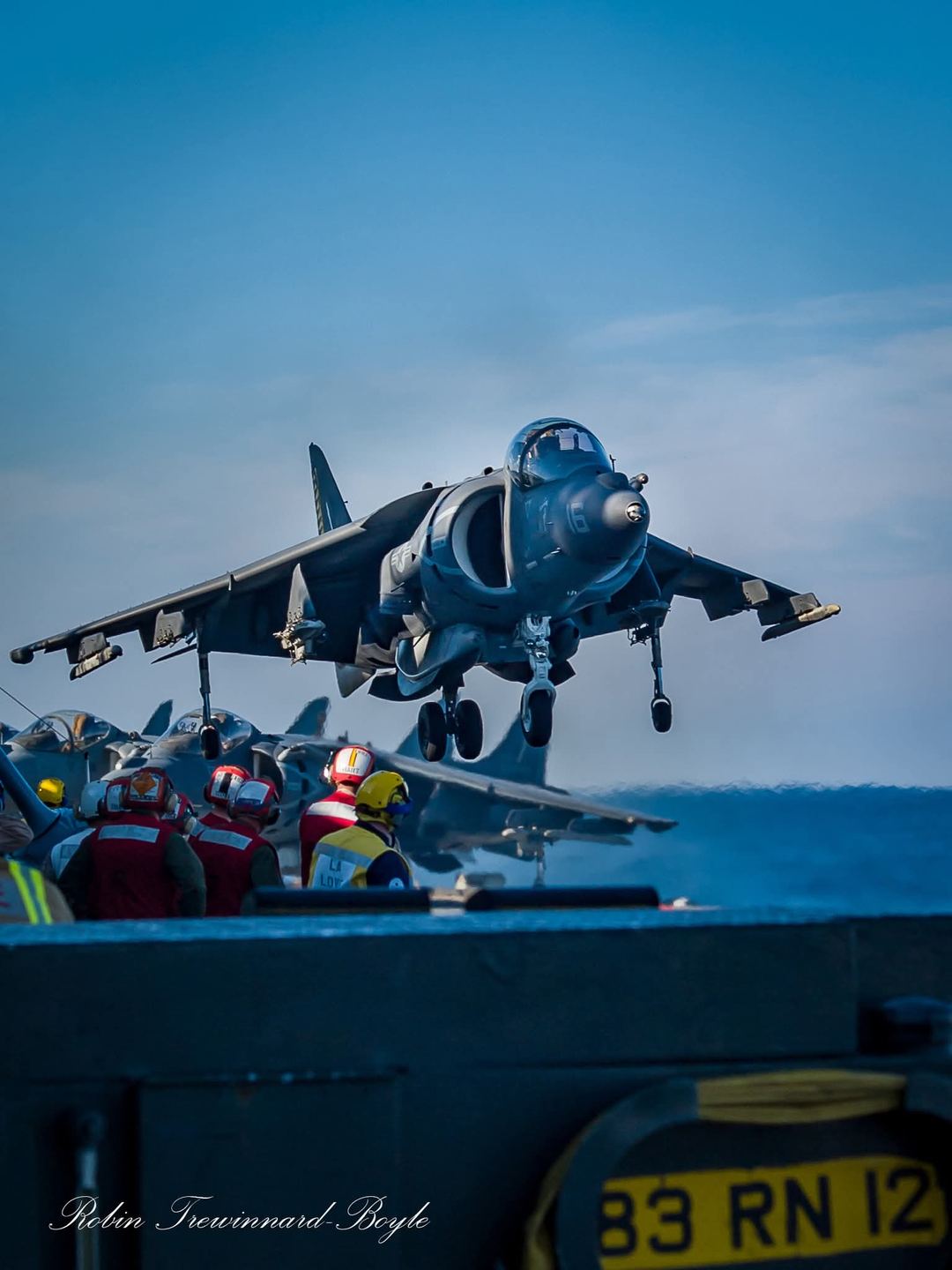 Happiness is Vectored Thrust!!

Working on an aircraft carrier flightdeck sometimes feels like you're on a movie set and I'd be lieing if I said that Topgun wasn't an influence on my career choice in the Royal Navy!

Back in the summer of 2010, VMA-223 and VMA-542 embarked onto HMS Ark Royal for Ex Capella Strike. Here's one of the photos I took back then, I took quite a lot!

Bright sunshine off the North Carolina coast led to deep shadows from the Island and strong contrasts on the colours.