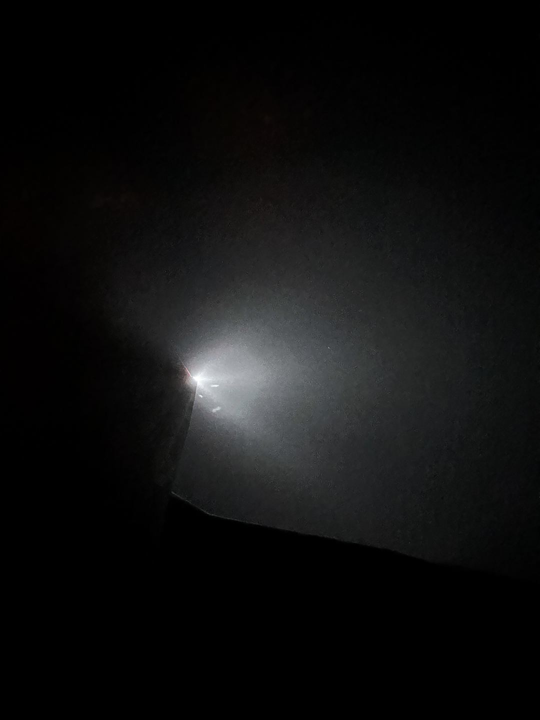 Qantas 330 through clouds at night.