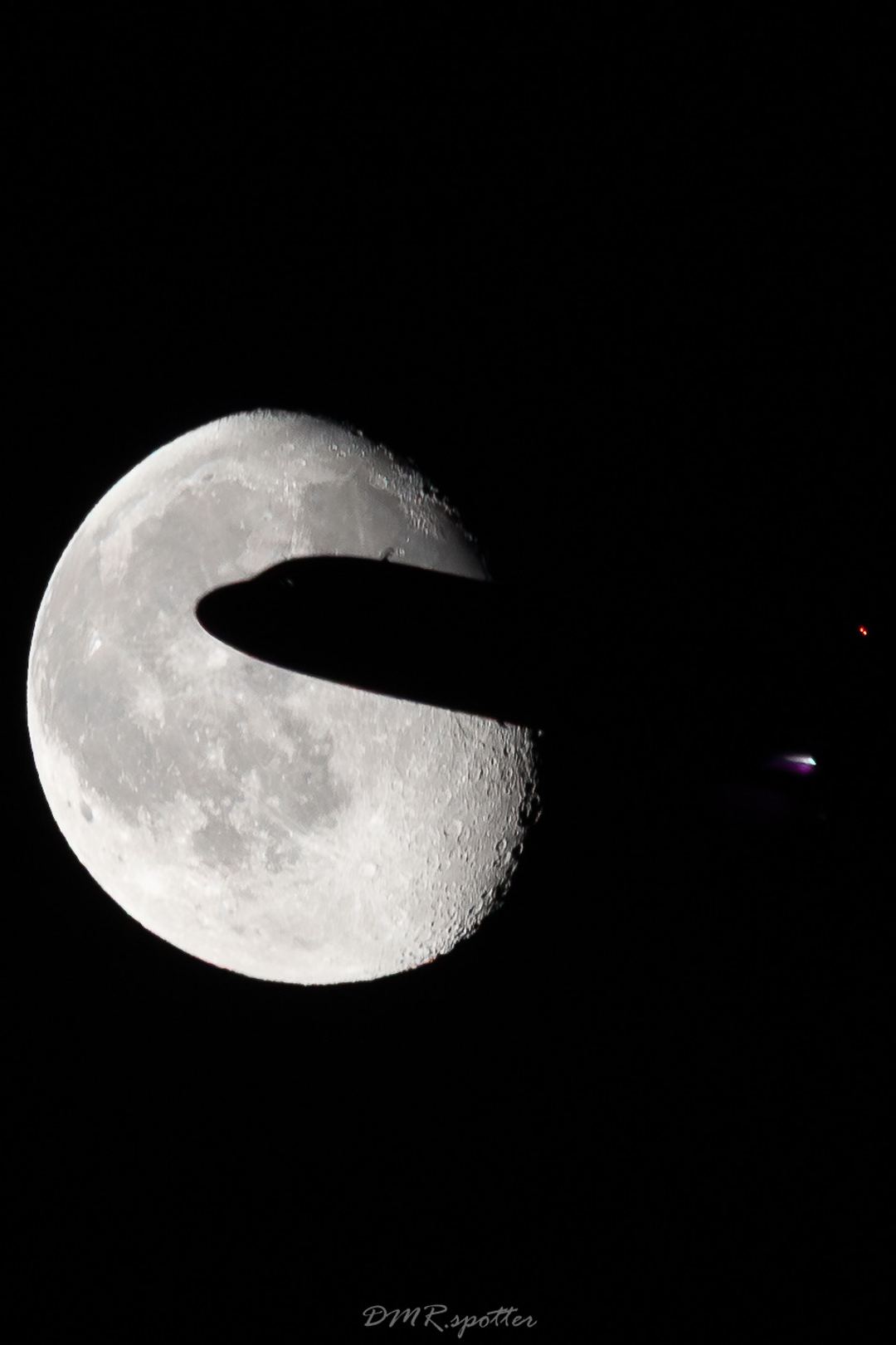 Wizzair a321 cutting through the moon while climbing off Turin airport.