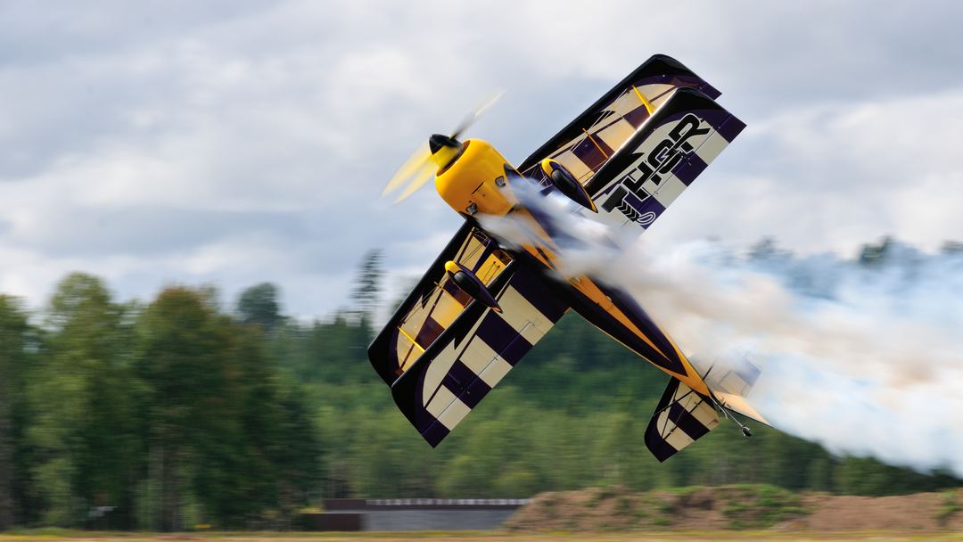 Power. Precision. Commitment.
The Model 12S "Thor" doesn't just perform aerobatics—it attacks the sky with relentless energy. Knife-edge passes, snap rolls, and smoke pouring from the wingtips make every display impossible to ignore.