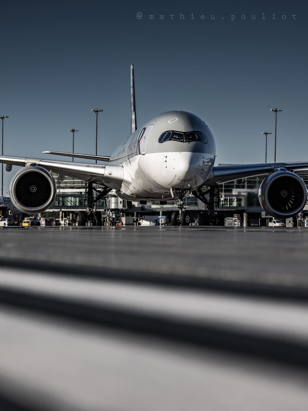 Qatar Airways A350 turns toward its stand.