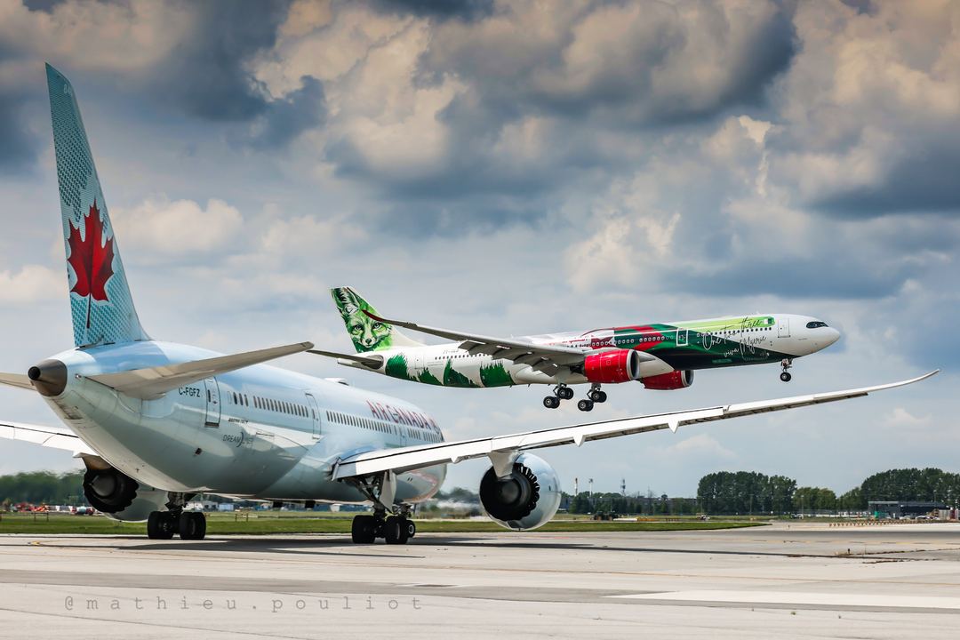 Air Algérie A330 over the piano keys watched by Air Canada B787 holding short.