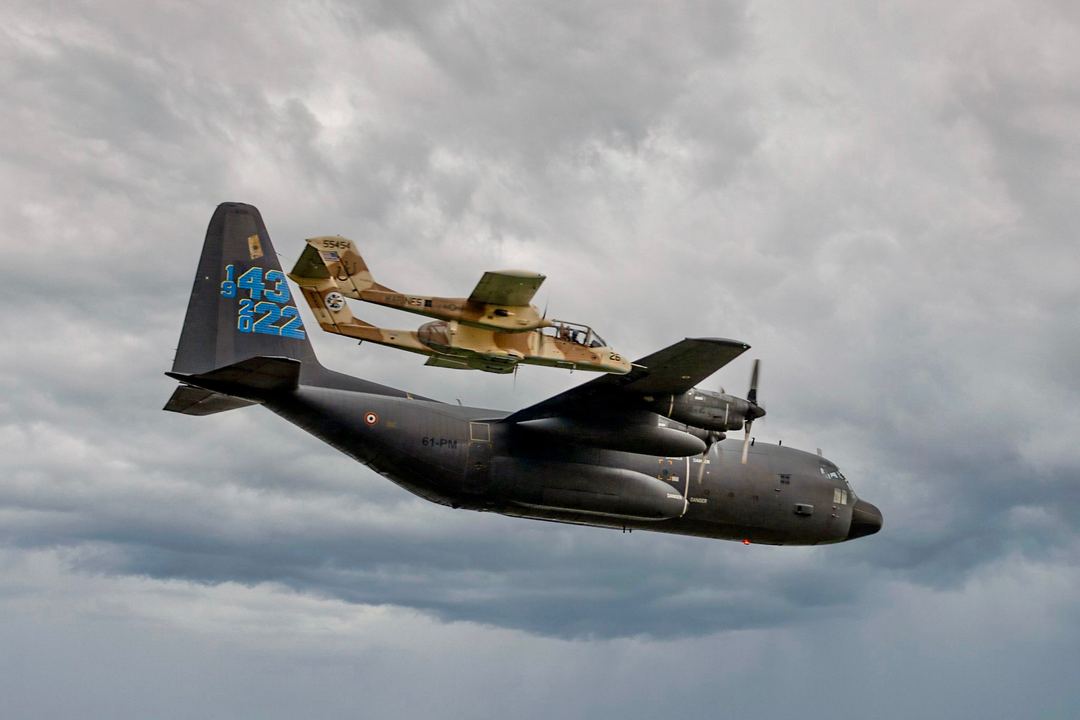 Lockend C-130 in formation with a North American Rockwell OV-10 Bronco