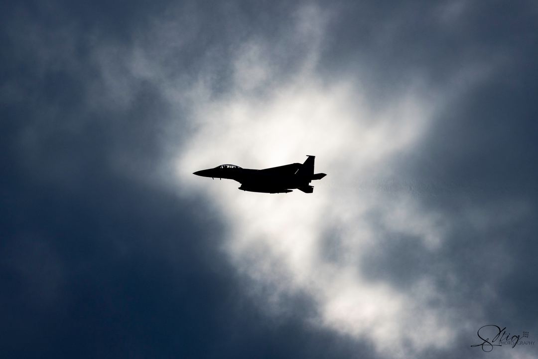 Just a shot of a  MO F15 breaking to line up to land at RAF Lakenheath, caught a small patch of light on a cloudy sky.