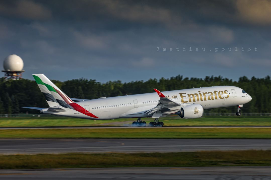 After a long flight from Dubai, Emirates A350 as EK243, finally touches down.