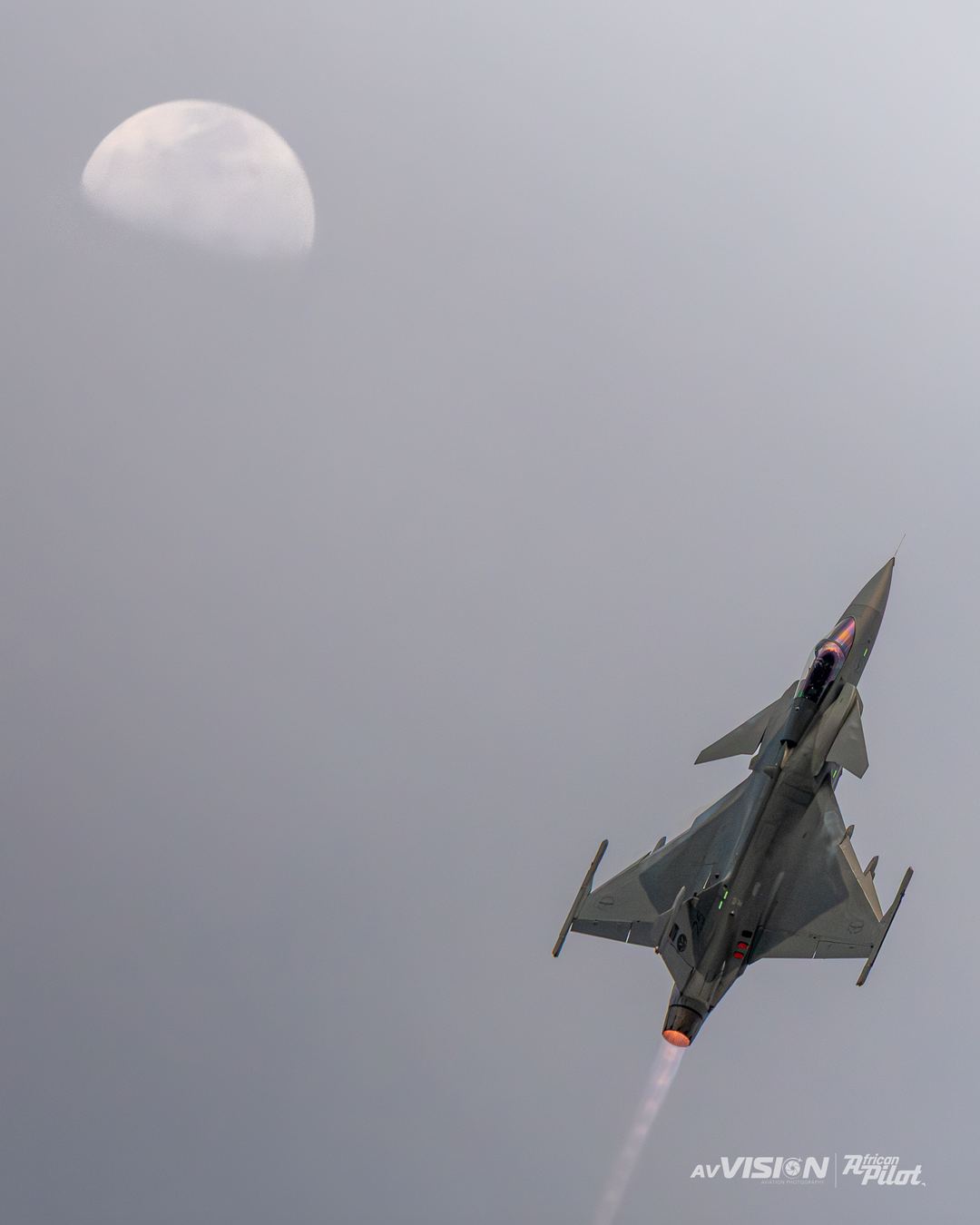 During the AAD25 2026 Expo and Airshow, the SAAF 2 Squadron Gripen flown by callsign "Cipher" went up for his last solo display of the show. I took note of the moon above me, and as I had been watching his sequence all week, I knew he would pull up straight, so I tried to position myself as best I could and I got really lucky to land the shot.