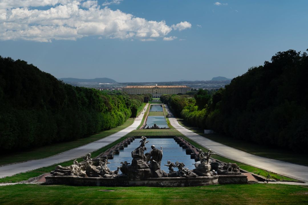 The gardens of the Royal Palace of Caserta stretching towards one of the largest royal residences in Europe. I waited for the moving clouds to paint the gardens with alternating light and shadow, adding a little more depth to the perfectly symmetrical composition.