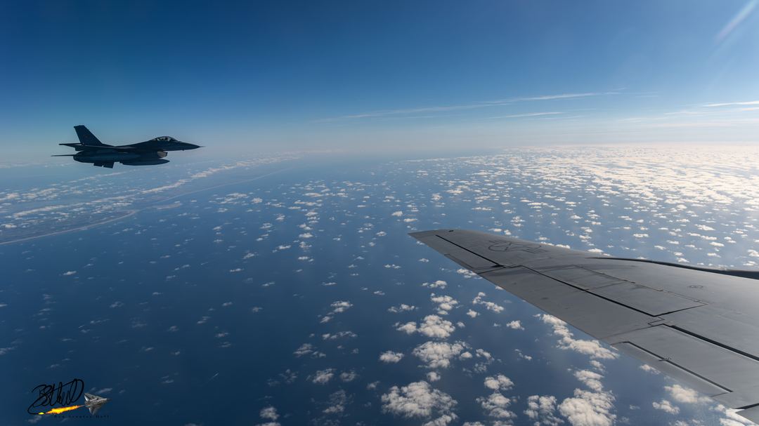 On a tanker flight out of RAF Mildenhall as part of Ramstein Flag 25. We departed Mildenhall slightly late and discovered the Turkish Air Force KC-135R on deployment had gone tech so we had to pivot from refuelling USAF assets to their receivers.

This meant we had to set up our refuelling box over the Dutch island of Texel. We refuelled a pair of Dutch F-35As, a pair of Turkish F-16s and pair of Romanian F-16s, one of which is seen here.

Whilst the F-16 is unfortunately in shadow, i like the fact the 1 35 wing, as well as the spotty cloud formation and the dutch coastlineare all present here. 

Those that have shot from the side windows of a KC-135 will know how small and usually scratched and dirty they are.