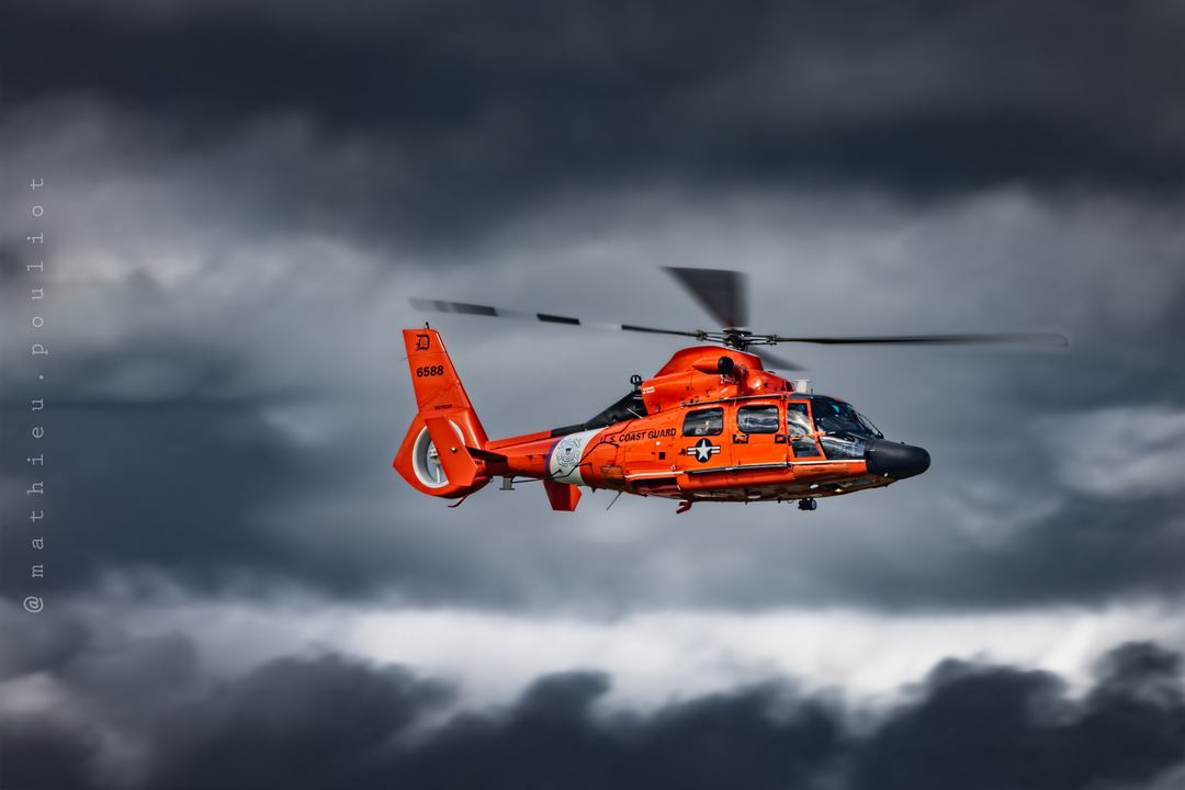 Got to love that bright orange against those dark clouds!!