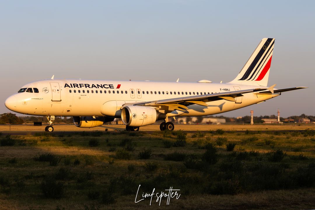 Airfrance a320 departing Bologna's airport during goldem hour time..