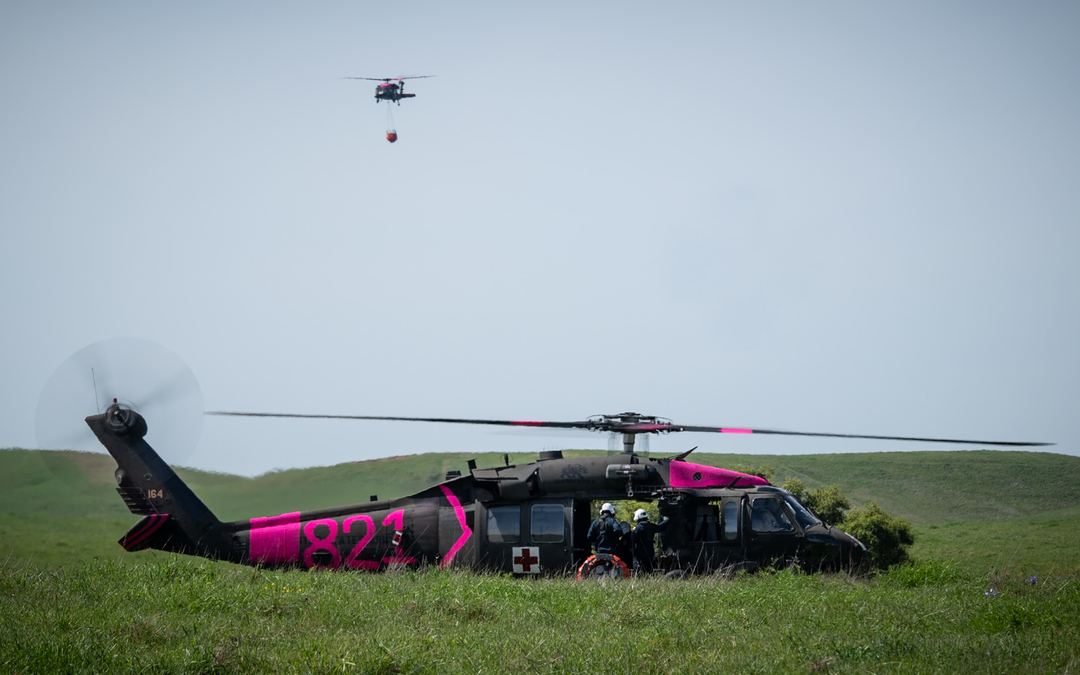 California National Guard training with  CalFire on a spring day.  The fresh hi-viz pink really stands out against the deep greens of the low foothills of Northern California 
