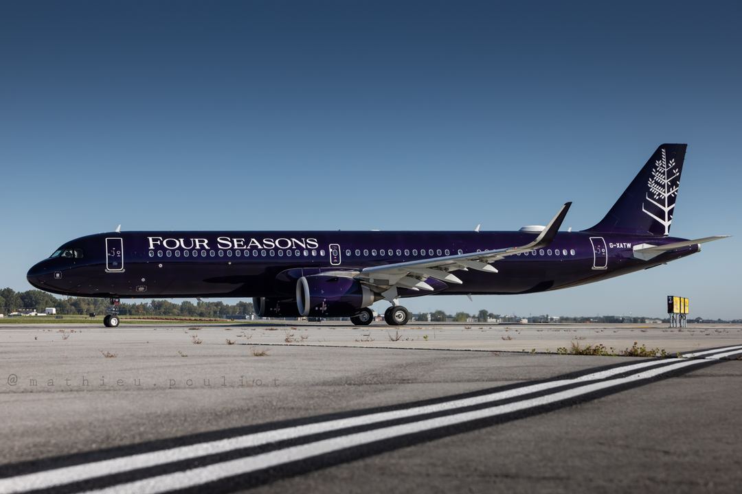 Titan Airways operated A321 for Four Seasons taxies for departure back to London.