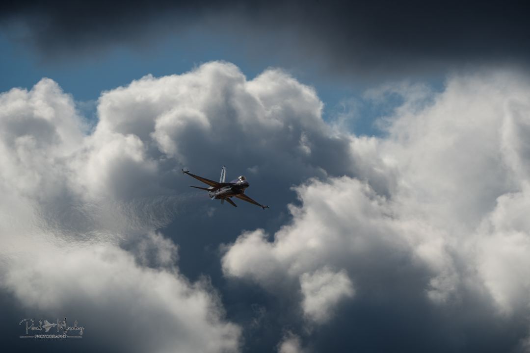 Royal Danish Air Force F-16 Solo Display Team between the stormy clouds. Captain Troels "TEO" Vang last display in the UK before the retirement of the aircraft.