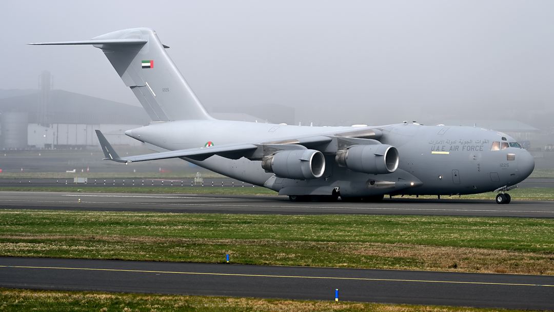 UAE Air Force C-17 going along the runway with the sun hitting the rear of the aircraft.