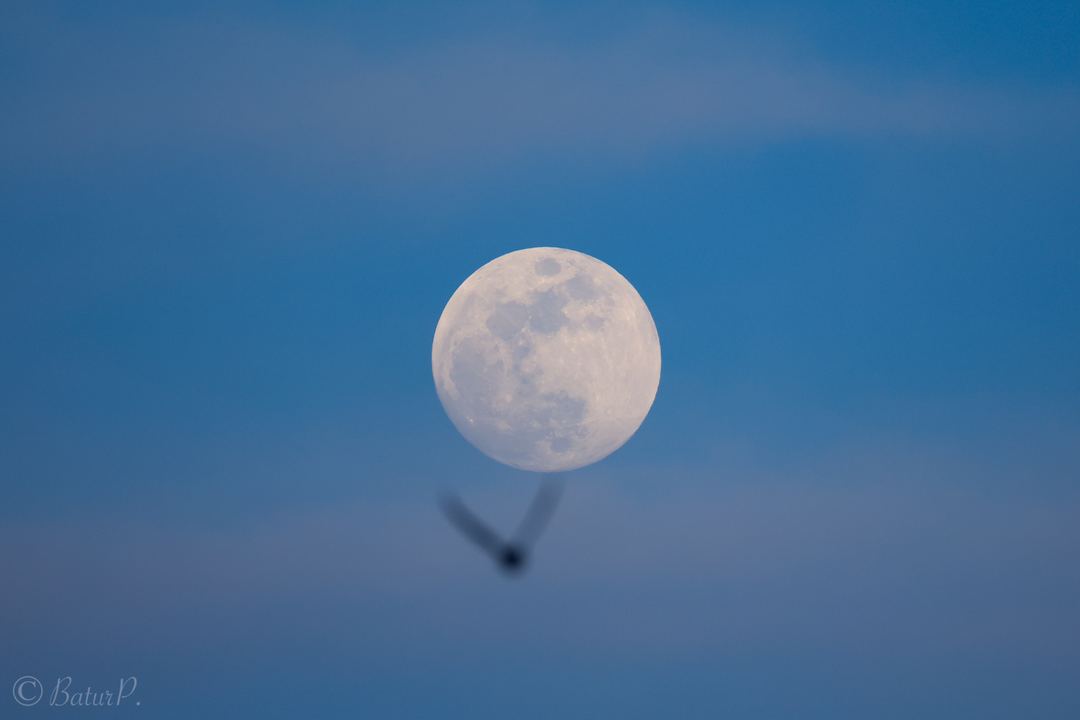 Moon is rising behind the clouds