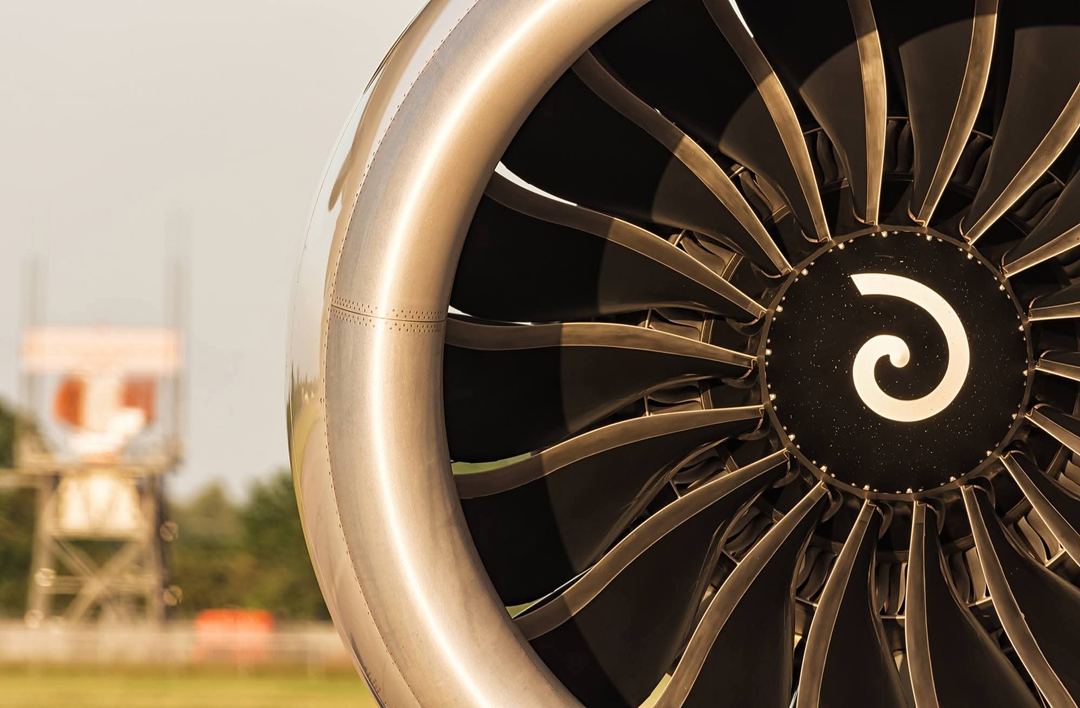 Low evening sunlight shining on the fan blades of a GeNx-2B67, 1 of the 4 massive engines that power this 747-8, LX-VCC of Cargolux, on stand at DSA a few years ago.